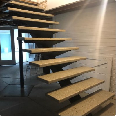 concrete residential stairs supported by steel beam