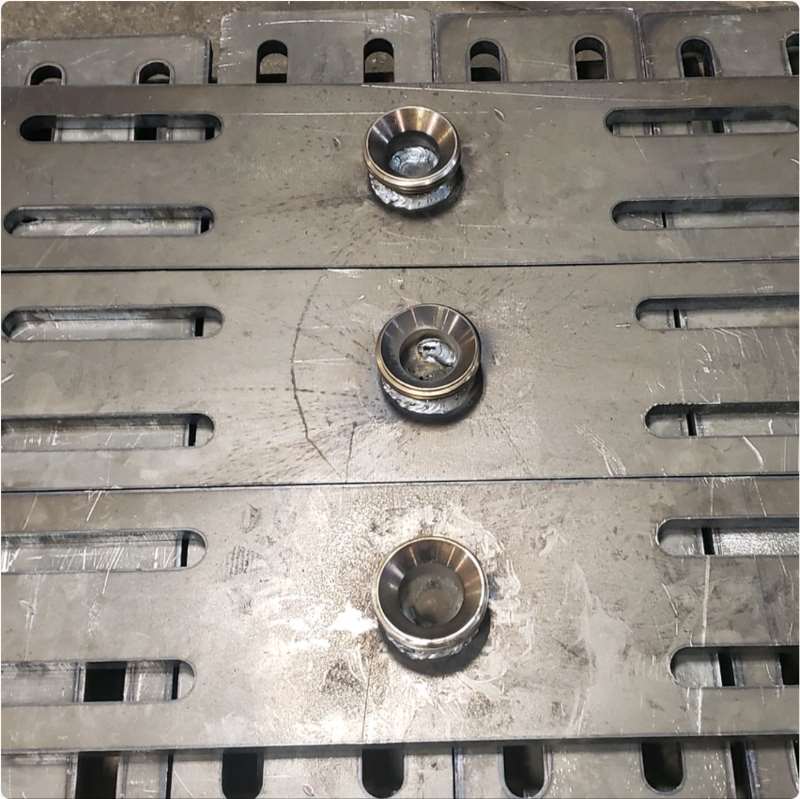 Top plates for adjustable pile cap pipe supports