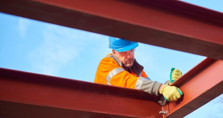 Metal_Building_Construction_5_red-iron-i-beam-framing-for-metal-building