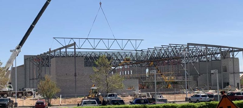 Super long span joist hoisted by mobile crane Bolted