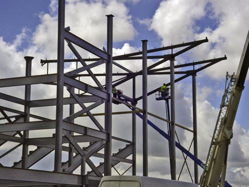 Steel Structure Roof Being Done By Cherry Pickers Mobile Cranes