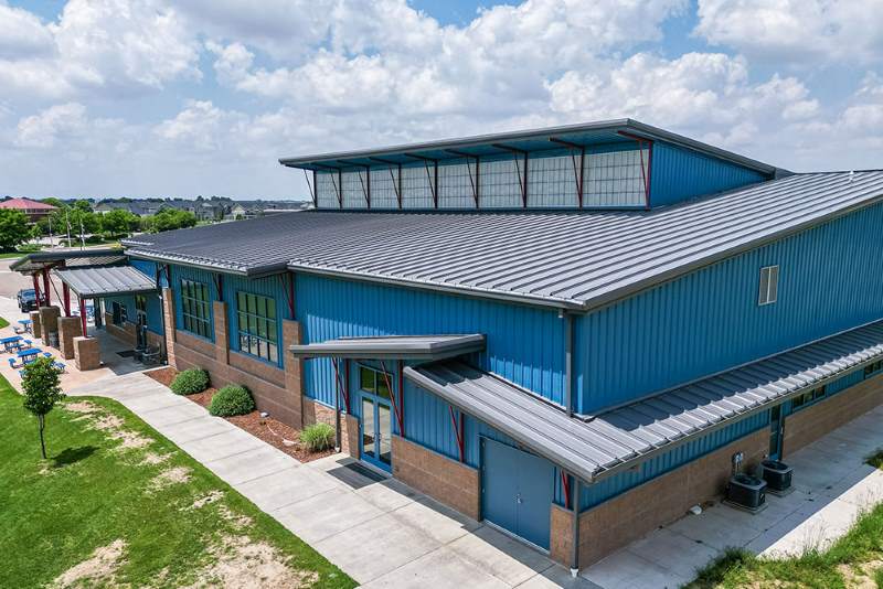 smoke colored standing seam roofing system formetal building with clerestory